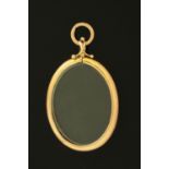 A 9 ct gold mounted glass locket, 62 mm x 48 mm excluding hanger.