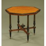 A Victorian Aesthetic Movement ebonised and amboyna wood octagonal centre table,