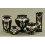 Five pieces of Shelley ware, Registered 680712, decorated with butterflies against the black ground.