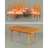 A Gordon Russell teak and Indian laurel dining table and eight chairs, Design No.