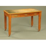 A Victorian pitch pine writing table,