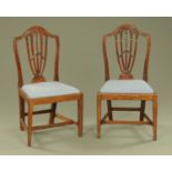 A pair of 19th century Hepplewhite style occasional chairs, each with pierced splat,