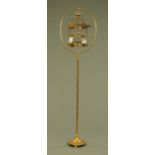 A Victorian brass bird cage on stand. Cage diameter 28 cm, overall height 190 cm.