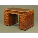 A Victorian mahogany pedestal desk, with brown tooled leather writing surface,