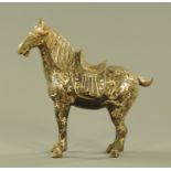 A Chinese bronze figure of a standing horse, with silvered coloured metal inlay. Height 29.