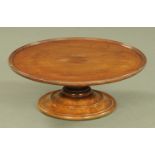 A 19th century mahogany lazy Susan, circular, with swivel action and turned base. Diameter 51 cm.