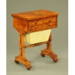 A Victorian walnut games/worktable, with turnover top and red tooled leather playing surface,