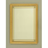 A gilt framed rectangular mirror, external dimensions 82 cm x 59 cm.