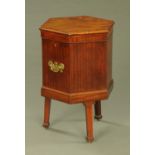 A George III mahogany hexagonal cellarette, with brass carrying handles to either side,