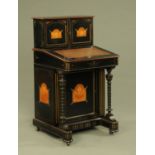 A Victorian ebonised Aesthetic Movement Davenport desk,