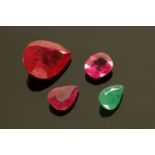 Three loose rubies and an emerald, largest stone 3.8 grams, 20 mm x 13 mm x 8 mm max.