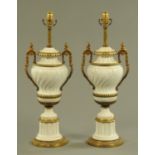 A pair of simulated marble table lamps, vase form, with handles and brass embellishments.