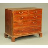 A George III mahogany chest of drawers,