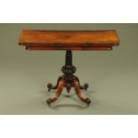 A Victorian rosewood turnover top tea table,