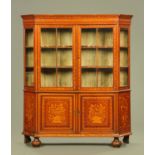 A 19th century Dutch marquetry cabinet, with moulded cornice and canted angles,