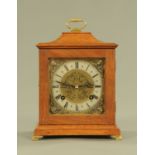 A mahogany cased mantle clock, with two train striking movement,