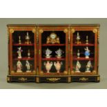 A Victorian boulle marquetry breakfront credenza, three door, with velvet lined shelves.