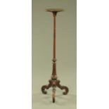 A Regency style torchere, with circular top,