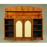 An early Victorian rosewood breakfront display cabinet, with rear upstand,