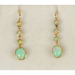 A pair of 15 ct gold opal earrings.