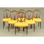 A set of six Hepplewhite style mahogany dining chairs, with shield shaped backs with pierced splats,