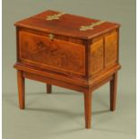 An inlaid mahogany rectangular box on stand, with brass hinges. width 56 cm.