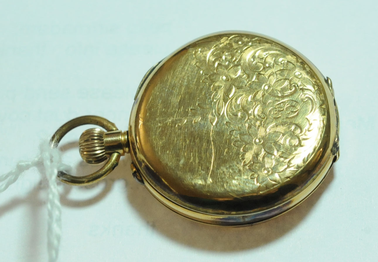 A 9 ct gold cased foliate engraved continental fob watch, stamped 9K, knob wind. Diameter 32 mm. - Image 7 of 7