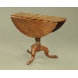 A George III mahogany twin drop flap circular tripod occasional table,