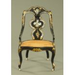 A Victorian papier mache occasional chair, inlaid with mother of pearl and with bergere seat.