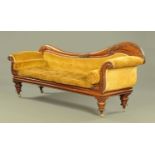 A Victorian mahogany settee, with foliate and scroll carved exposed showframe,