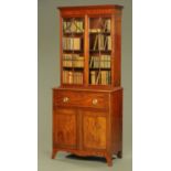 An early 19th century mahogany secretaire bookcase,