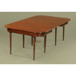A George III mahogany dining table,