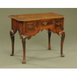 A George III oak lowboy,