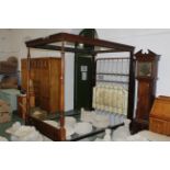 Mahogany four poster double bed with sprung base and floral headboard