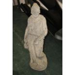 Stone garden ornament of a female with jug