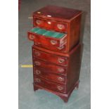Bowfronted miniature 7 drawer chest, 1920s, the top level with baize lined interior,