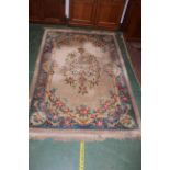A large blue and cream oriental rug