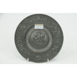 Heavy pewter embossed plaque, diameter 19.