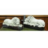 Pair of garden ornaments in the form of lions lying on plinths, length 56 cm, height 30 cm,