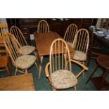 Ercol drop leaf table with six chairs