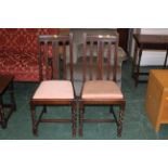 Pair of oak dining chairs with bead decoration and barley twist legs