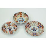 Two Imari plates, diameters 18 cm and 21 cm, and Imari bowl,