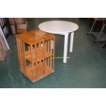 Oak revolving bookcase and white circular table