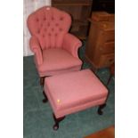 Red patterned button back wing armchair and footstool