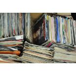 Box of records singles, to include Abba Waterloo, Eric Clapton Wonderful Tonight,