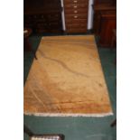 Large brown patterned tasselled rug