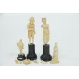 Four ivory carved figures "Mr Pickwick" etc