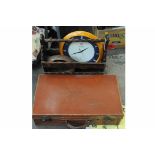 Vintage leather suitcase, wooden magazine rack, wall clock, wooden bowl, etc.