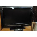 Bush flat screen TV with built in DVD player and remote