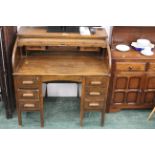 Oak tambour fronted roll top desk